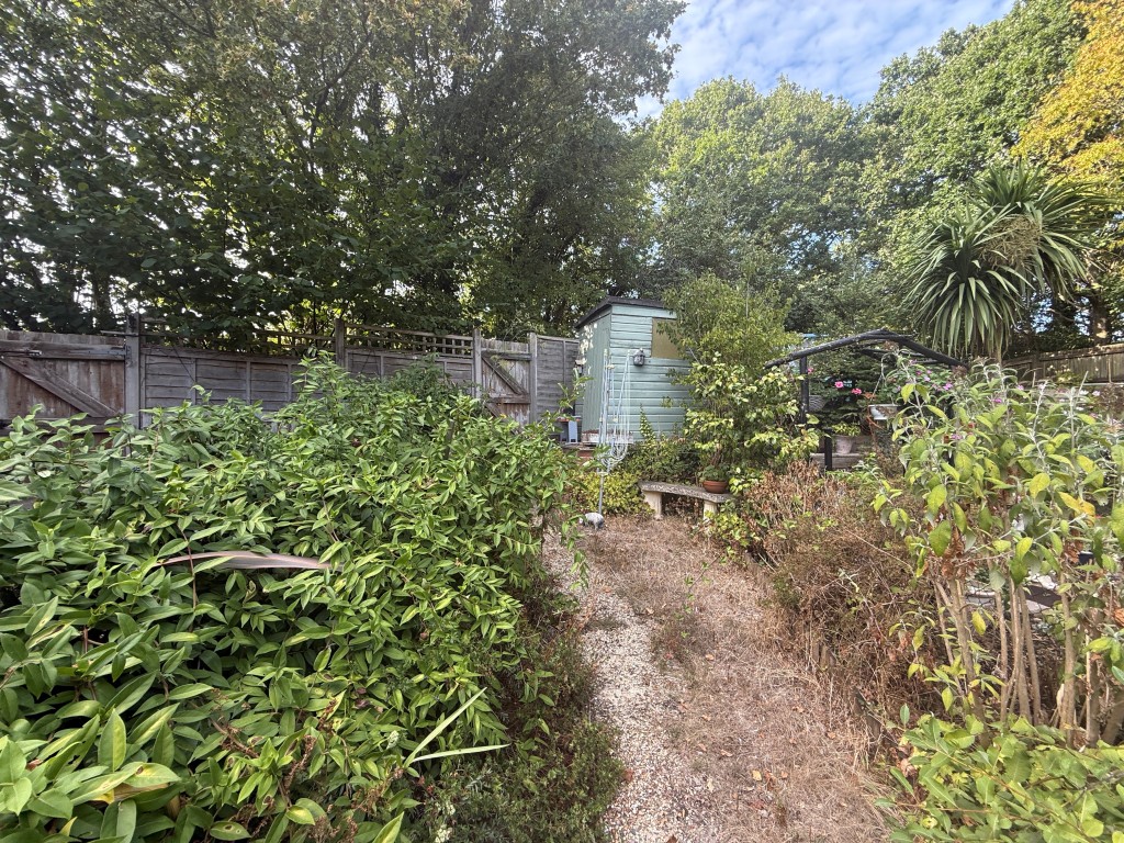Lot: 131 - TWO-BEDROOM HOUSE FOR INVESTMENT OR OCCUPATION - Upper part of garden with shed
